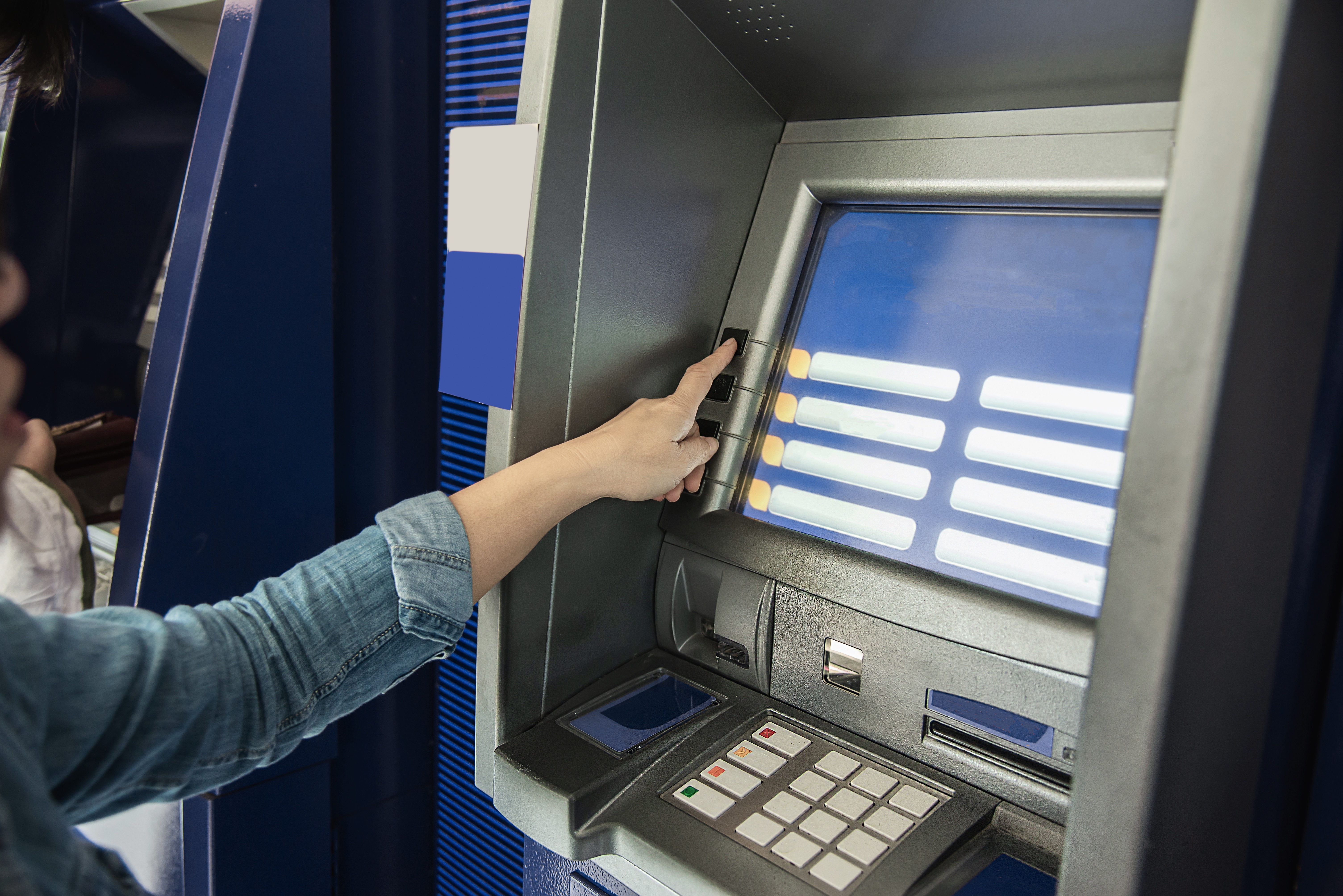 people waiting to get money from automated teller machine people withdrawn money from atm concept